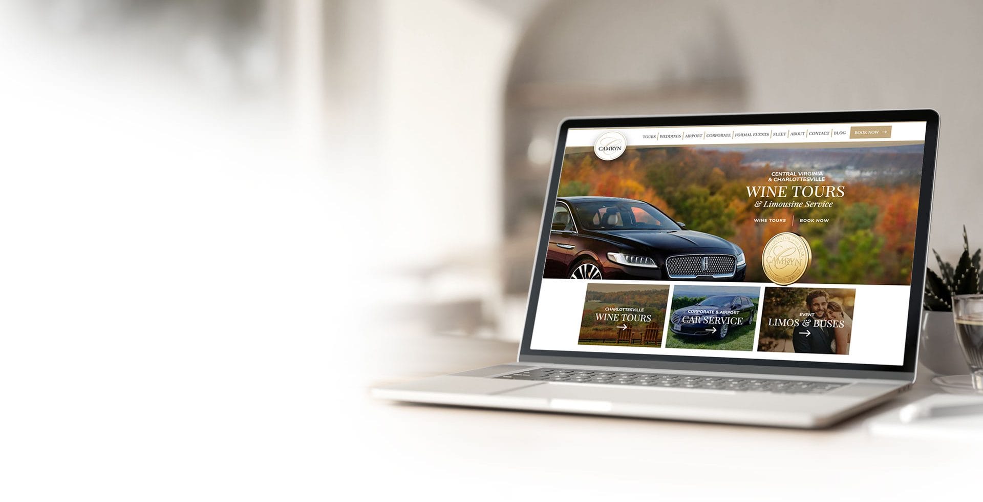 An open laptop computer on table showing a new Charlottesville web design for a local business in Virginia.